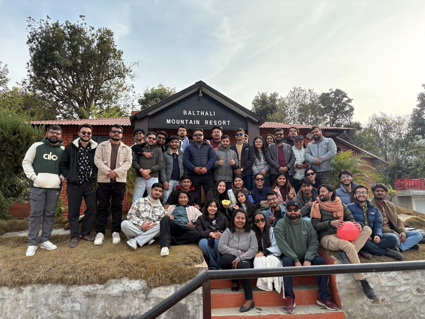 The full Anup S. & Associates team gathered outside Balthali Mountain Resort on a company offsite.